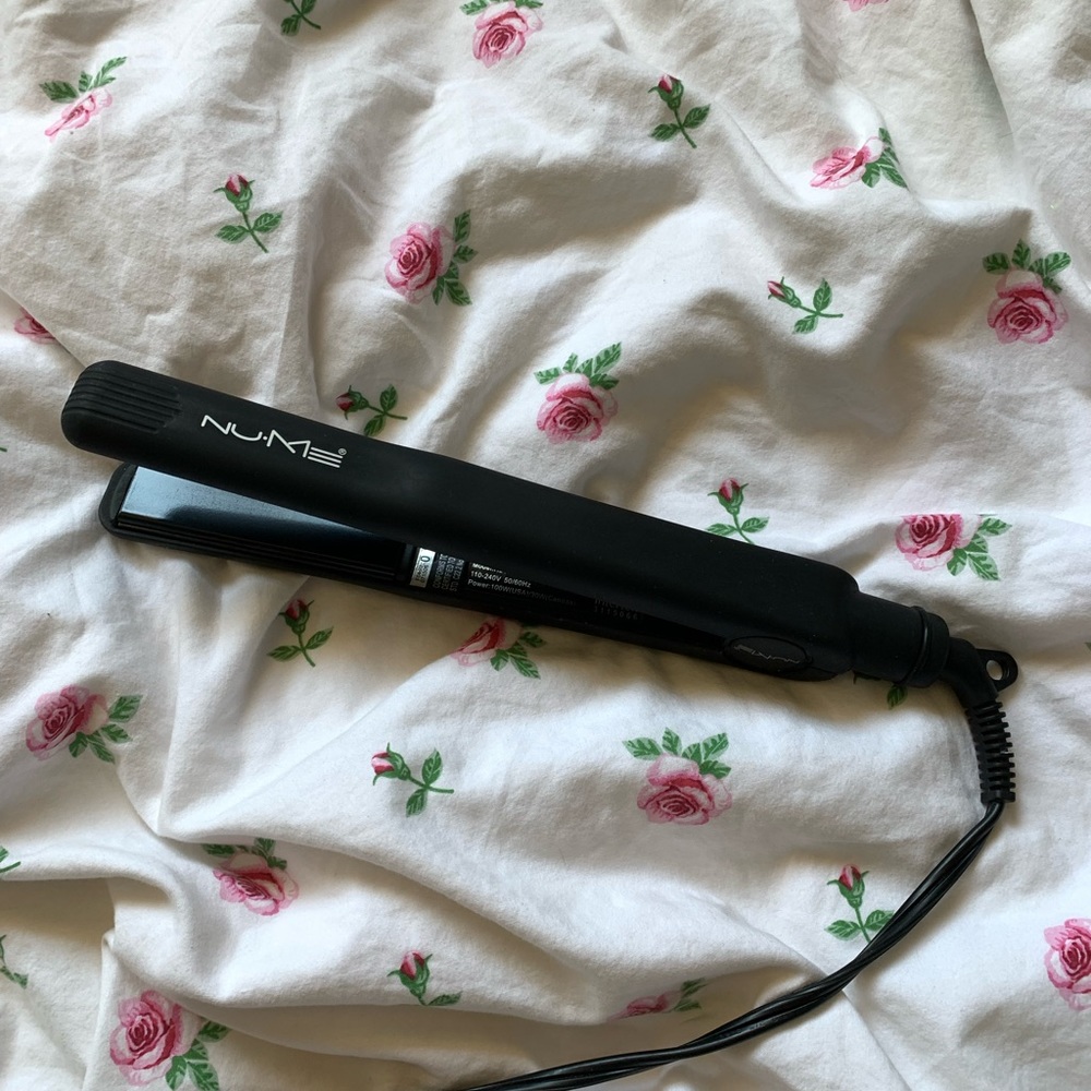 Medium sized, black NuMe hair straightener